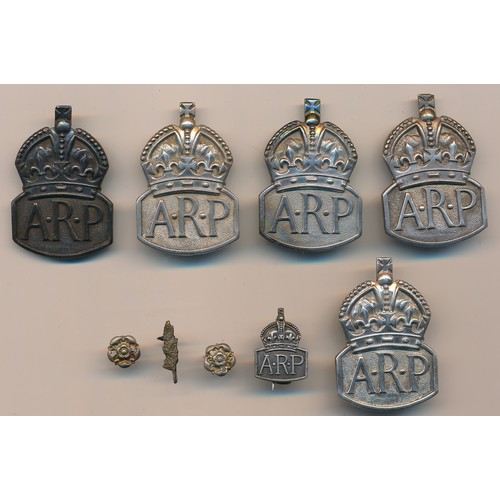 53 - A group of five Second World War hallmarked silver ARP buttonhole badges, with further miniature ARP... 