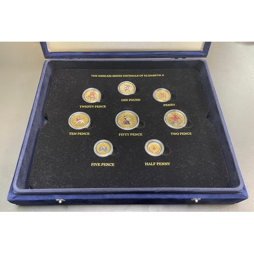 212 - Collection of gold plated and coloured coin sets with 