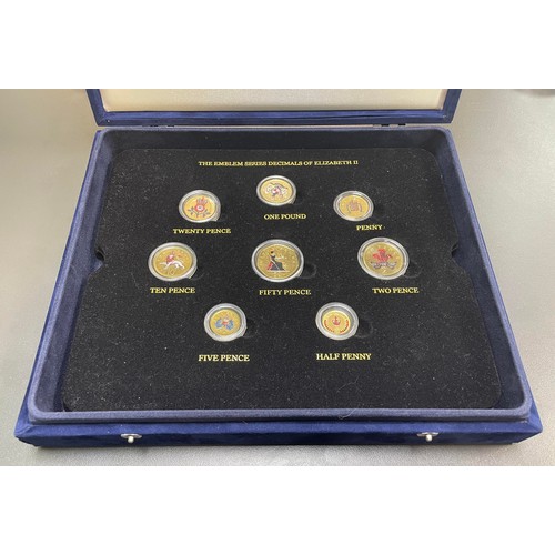 212 - Collection of gold plated and coloured coin sets with 