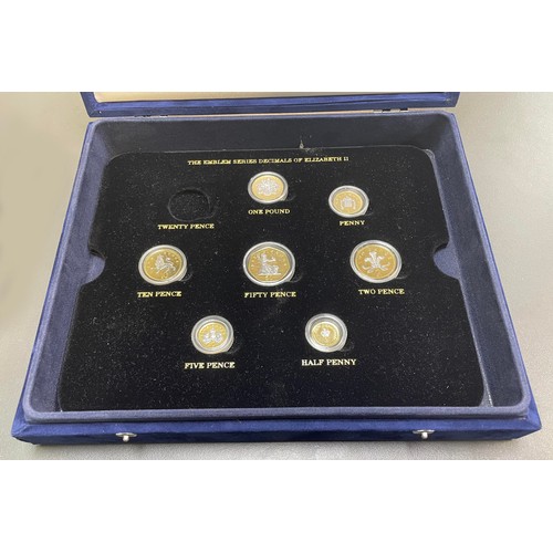 212 - Collection of gold plated and coloured coin sets with 