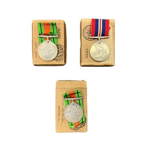 28 - Second World War - Three medals including The Defence medal 1939-45. In O.H.M.S Official Paid box ad... 