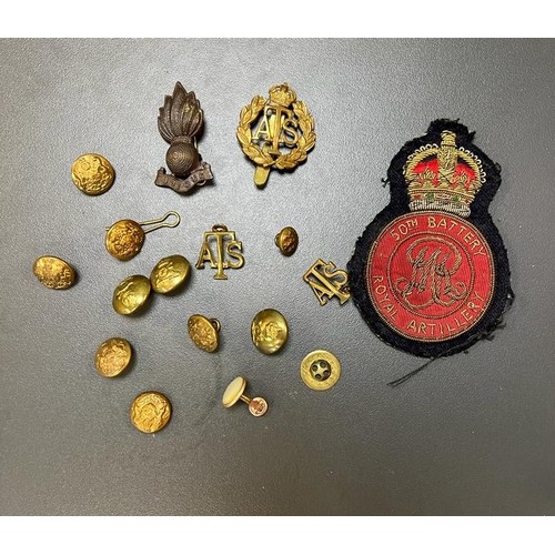 54 - A selection of various cap badges, shoulder titles & military buttons in wooden box, to include; cap... 