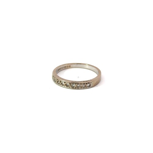 6 - An 18ct white-gold half eternity ring set with single cut diamonds, size P. Hallmarks for Birmingham... 