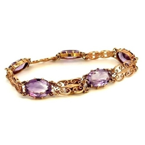 53 - Amethyst fancy link bracelet -  5 amethysts set in a 9ct gold bracelet - hallmarked.  Amethyst are o... 