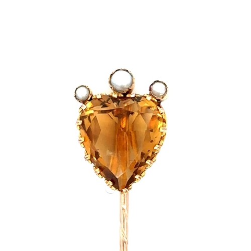 17 - An unmarked gold citrine and split pearl pin, length 75mm. Citrine is heart shaped, in good conditio... 