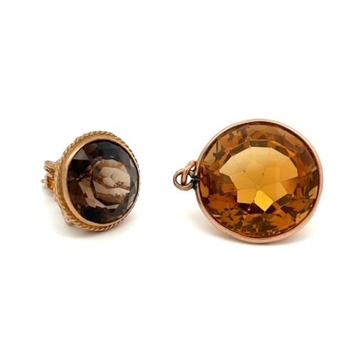 66 - A 9ct gold citrine pendant, citrine approx 37ct, 22mm diameter. And a 9ct smoky quartz fob, weight 6... 