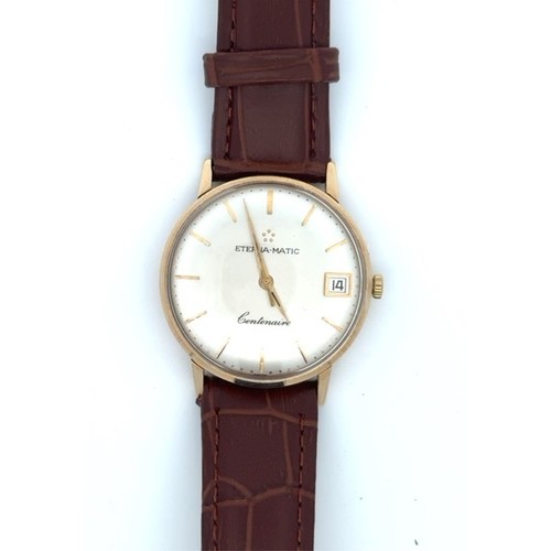 144 - An Eterna Automatic Gents 9ct Gold watch wih leather strap. no. 104025.