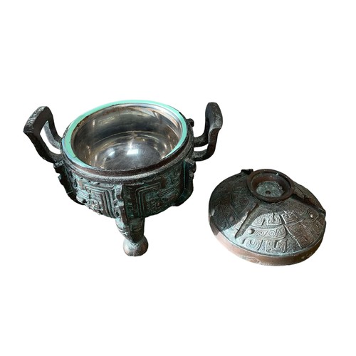 123 - Chinese 20th Century Ice Bucket after James Mont, cast iron with a faux bronze patina. Detailed patt... 