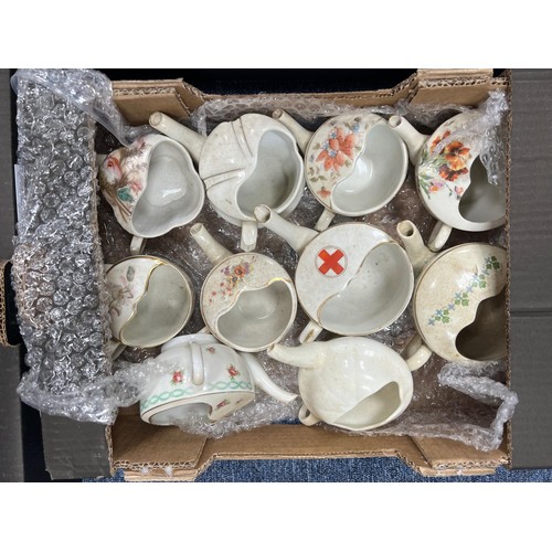 328 - Ceramics. Collection of 38 invalid feeders, with Red Cross (8), Johannesburg Hospital (1), 