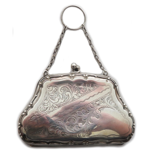 76 - 2 silver finger purses and a silver compact all engraved with foliate decoration. Includes a George ... 