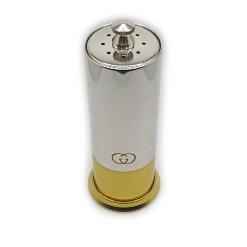 106 - Gucci – A vintage Gucci Pepper Mill/Salt Shaker, in a silver & gold metal finish with GG logo engrav... 