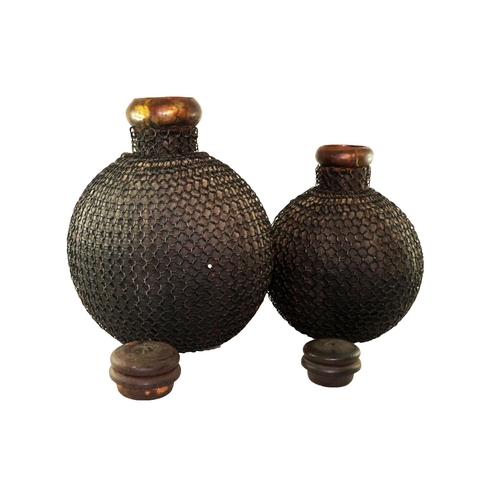 73 - A pair of 20th century tribal metal Jali/Matka pots with linked chain jackets and their lids.