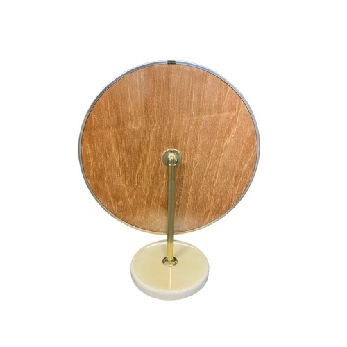 183 - A pair of 1970’s retro style Schreiber circular dressing table mirrors, with the adjustable plate on... 