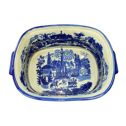 318 - Victoria Ware blue and white twin handled ironstone footbath, decorated with transfer printed citysc... 