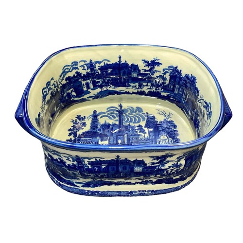 318 - Victoria Ware blue and white twin handled ironstone footbath, decorated with transfer printed citysc... 