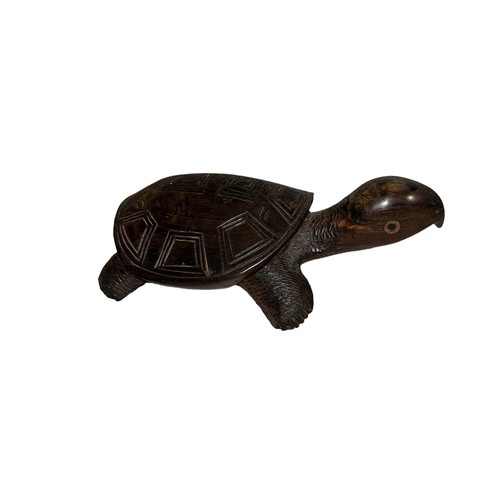 215 - A wooden sculpture of a turtle, some wear to the shell. Length 19cm.