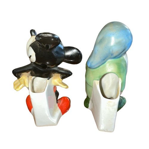 321 - A pair of 1930’s Walt Disney novelty ceramic toothbrush holders, with Mickey Mouse stamped Genuine W... 