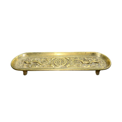 96 - An antique bronze lizard patterned tray with four feet, useful for jewellery. Length 25cm.