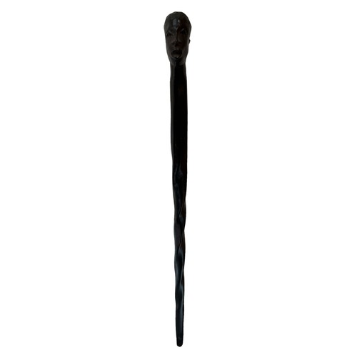 71 - An African carved hardwood twisted walking stick with carved head top. Height 83cm.