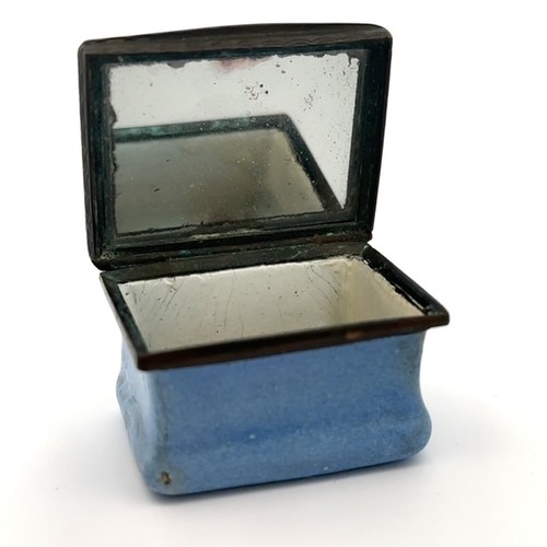 53 - A Battersea/ Bilston rectangular blue enamel patch box in  good condition with original mirror. Hing... 