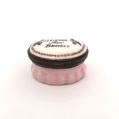 55 - An oval Bilston enamel patch box with light pink fluted base and hingled lid with two coloured love ... 