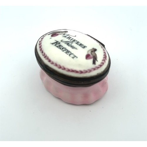 55 - An oval Bilston enamel patch box with light pink fluted base and hingled lid with two coloured love ... 