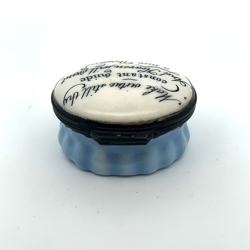 56 - An oval Bilston enamal patch box with blue fluted base and monochrome hinged lid with motto 'Make vi... 