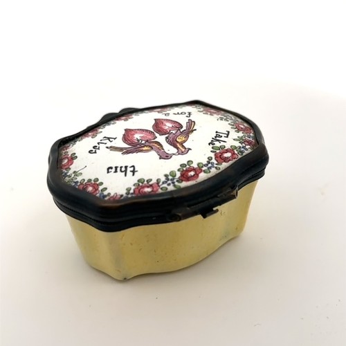 58 - An enamel patch box, probably late 18th Century Bilston.  Yellow body with hinged lid with the motto... 