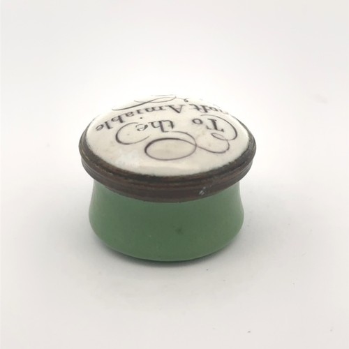 59 - A small round Bilston enamel box with green body and lid with monochrome motto 'To the moft amiable.... 