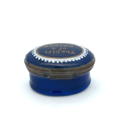 60 - A Wednesbury style royal blue oval enamel patch box. Hinged lid with gilt motto 'The gift of a frien... 