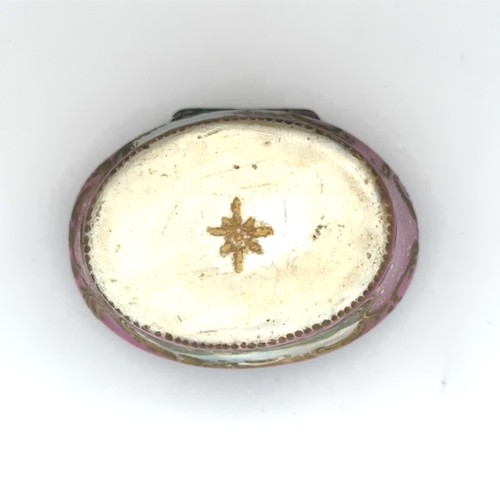 61 - An enamel hand painted pink enamel patch box, probably Bilston with a hinged lid (some damage to met... 