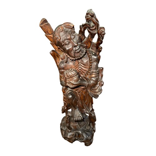 126 - A Japanese root wood carving of a man (Sage) stood on one leg holding an ajar box with a small duck ... 