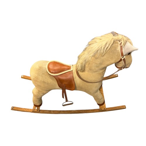 140 - A cord covered rocking horse.