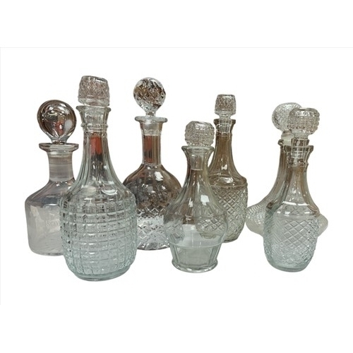 176 - Selection of seven moulded glass decanters, assorted sizes and designs including Edinburgh crystal “... 