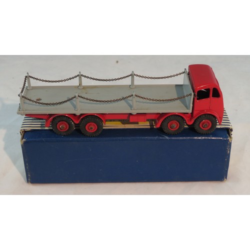 260 - Dinky. Foden Flat Truck with Chains No. 905, generally excellent in good blue and white striped lift... 