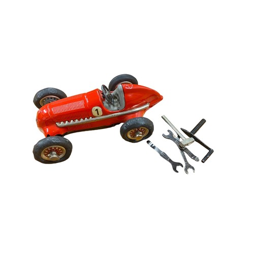 111 - Schuco. Studio red racing car No. 1050, clockwork with key, generally excellent (deformed rubber tyr... 