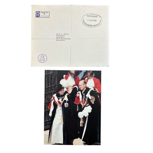 849 - A 1991 Christmas card from HM Queen Elizabeth II. The cover is a photograph showing the Queen and Th... 