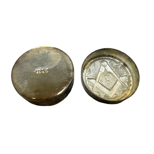 409 - A small silver Masonic pill box with the Masonic emblem on the front. Marked 925 to base. Diameter a... 