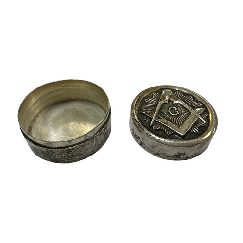 409 - A small silver Masonic pill box with the Masonic emblem on the front. Marked 925 to base. Diameter a... 