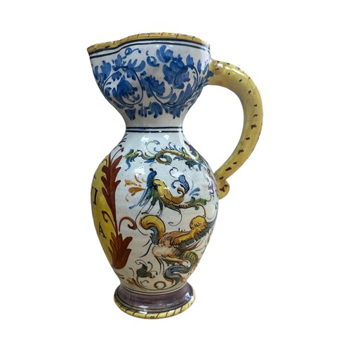 362 - An Italian maiolica (tin glazed) apothecary jug.  Decoration surrounds central reserve on which is w... 