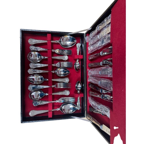 266 - A Webber & Hill stainless steel and silver plate canteen of cutlery for 6 people.