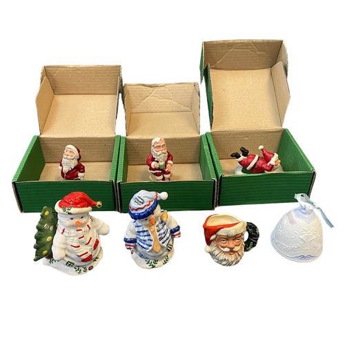 429 - A collection of Christmas & Santa themed ceramic items, with many collectable plates to include; Cav... 