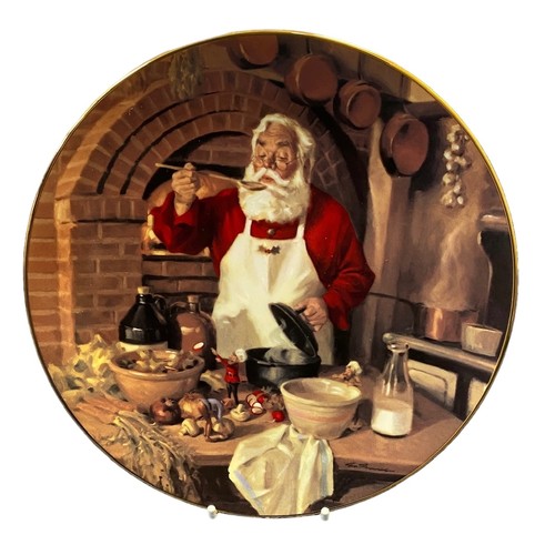 429 - A collection of Christmas & Santa themed ceramic items, with many collectable plates to include; Cav... 