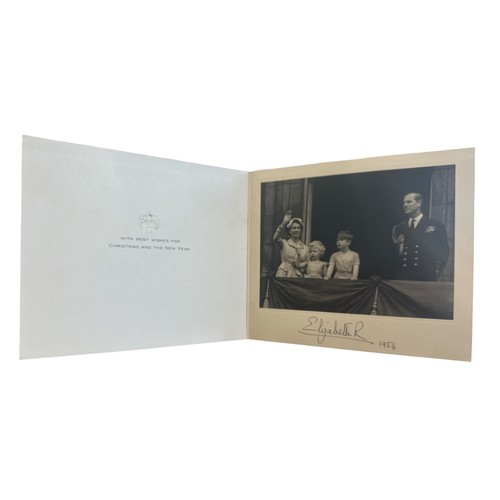 822 - A 1954 Christmas card signed by HM Queen Elizabeth II. Gilt crown to cover, interior with a photogra... 