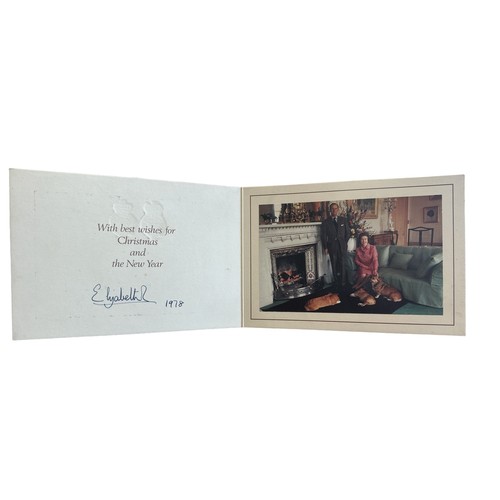 838 - A 1978 Christmas card sent by HM The Queen. Twin gilt Royal cyphers to cover. Interior with photogra... 