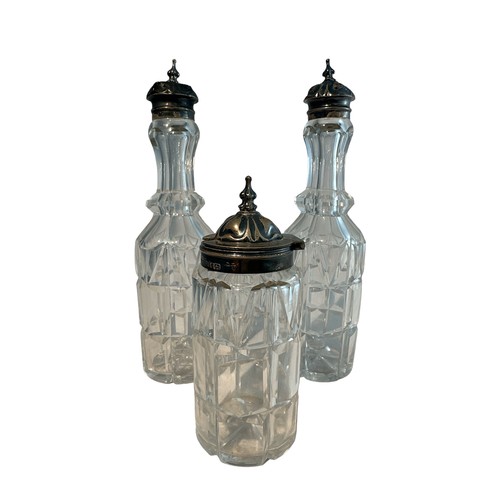 341 - Three Victorian cut glass bottles with silver mounts, probably part of a cruet set. Birmingham hallm... 