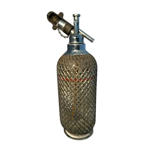 153 - An early 20th century Sparklets Ltd of London glass soda siphon, with mesh design round glass, 35 cm... 