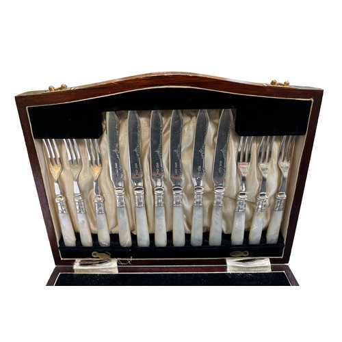 173 - A twenty-four piece Victorian silver dessert cutlery set with silver forks and blade on mother of pe... 