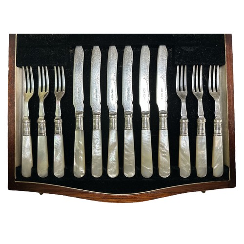 173 - A twenty-four piece Victorian silver dessert cutlery set with silver forks and blade on mother of pe... 