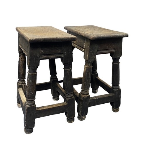 143 - Pair of 17th Century oak joint stools / coffin stools, plank tops on turned legs joined by stretcher... 